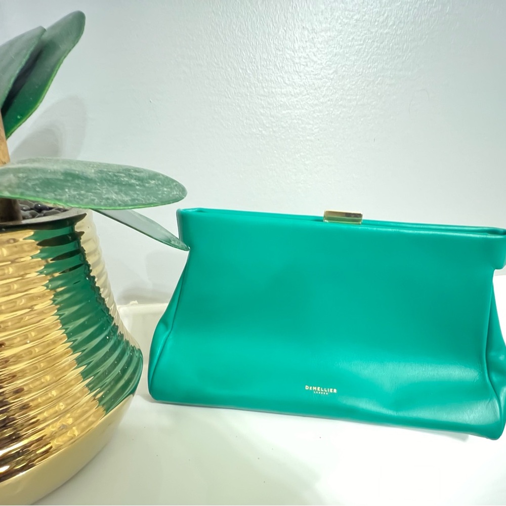 DeMellier London Cannes clutch bag in a green smooth leather